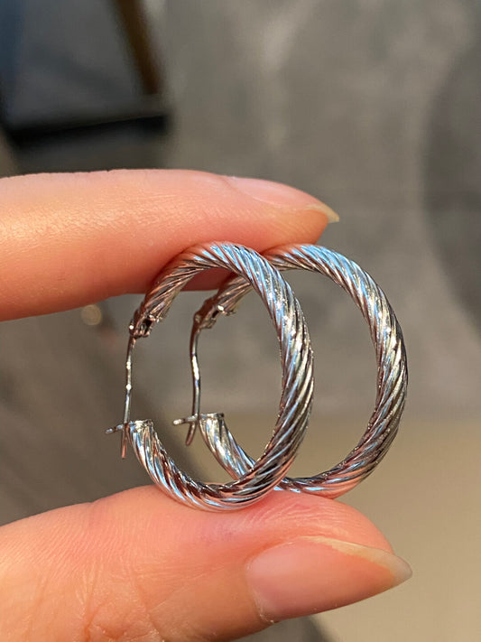 Crafted sterling silver twist circle earrings